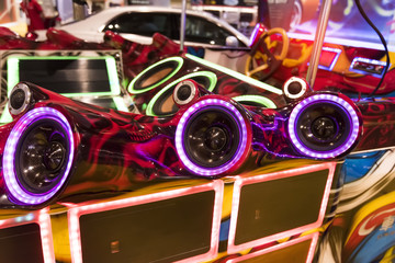 Wall Mural - colorful lights of stereo and speakers in car in the night