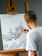 © hadkhanong - Closeup asian artist drawing black ink pen on white canvas place on easel.