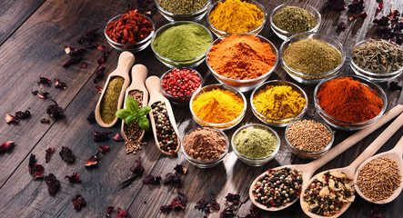 Variety of spices and herbs on kitchen table