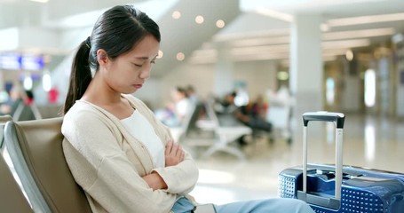 Wall Mural - Woman sleeping in the airport