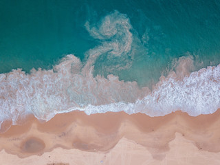  aerialy of beach and sea meeting each other