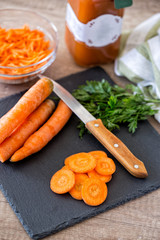 Wall Mural - cutting carrots on slice on chopping board in the kitchen.