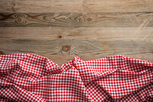 Red White Checkered Picnic Tablecloth On Wooden Background, Copy Space