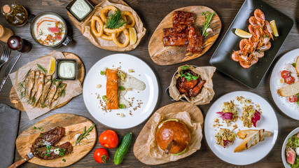 Poster - Assorted dishes top view pork ribs, beef steak, salmon steak, chicken wings, Burger with meat, squid Rings