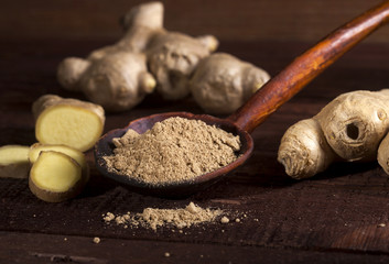 Wall Mural - Ginger root and ginger powder on wooden background