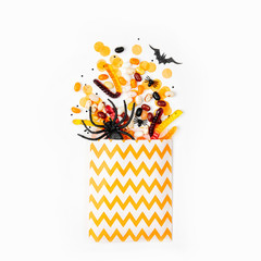 Wall Mural - Party favor bag with colorful candy. Trick or Treat, concept for Halloween.  Flat lay, top view