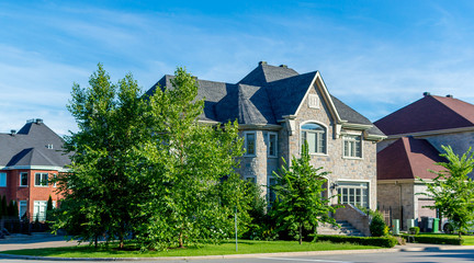 Luxury house in Montreal, Canada against blue sky