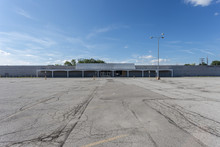 Large Empty Storefront And Empty Parking Lot