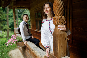  Beautiful bride and groom in the ukrainian style are standing w