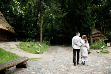  Beautiful bride and groom in the ukrainian style are standing w