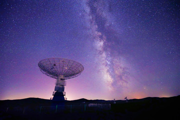 Radio telescopes and the Milky Way at night