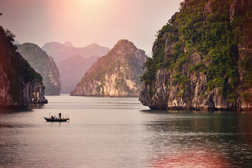 Halong bay boats,Sunset at Ha Long Bay scenic view , Hanoi, Vietnam