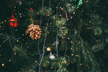 Wall Mural - vintage christmas tree with pine cone decoration and sparkle light filter effect. christmas and new 