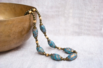 Bohemian beaded necklace from polymer clay. Handmade jewelry. Turquoise necklace in indian style. Oriental culture jewelry.