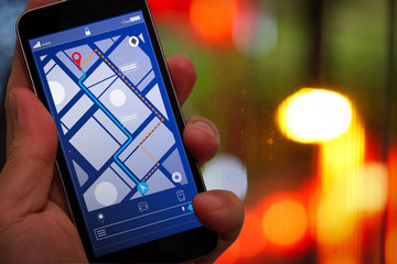 Poster - Close up of Tourist using GPS map navigation on smartphone application screen for direction to destination address in the city with travel and technology concept.