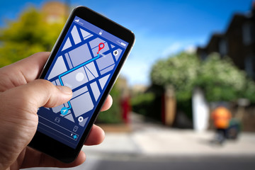Poster - Close up of Tourist using GPS map navigation on smartphone application screen for direction to destination address in the city with travel and technology concept.