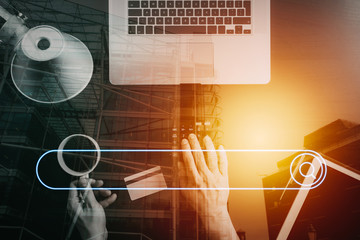 Aufkleber - Internet shopping concept.Top view of hands working with calculator and laptop and credit card and tablet computer on dark wooden table background with buildings exposure