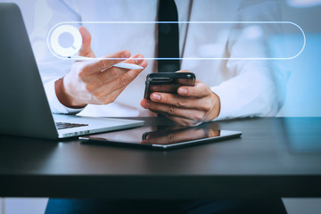 Aufkleber - close up of businessman working with smart phone on wooden desk in modern office with virtual icon diagram with glass reflected view