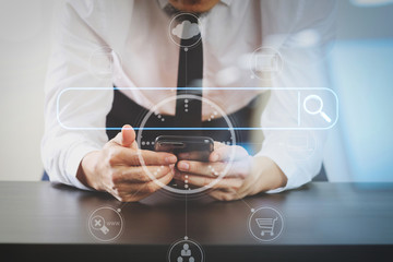 Aufkleber - close up of businessman working with smart phone on wooden desk in modern office with virtual icon diagram