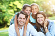 © Kalim - Young family with children having fun in nature