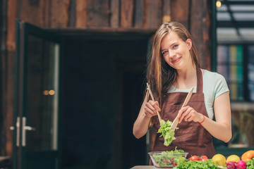 Smiling woman in the kitchen