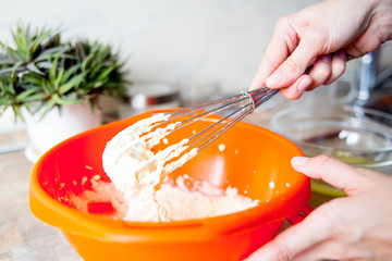 Woman making delicious chicken pot pie on a table