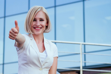 beautiful businesswoman high five with female partner cityscape glass offices background . teamwork and successful deal idea