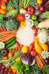 Wall Mural - Fresh farm produce, colorful vegetables on wooden pine table, healthy background, copy space for text in the middle, top view, vertical, selective focus