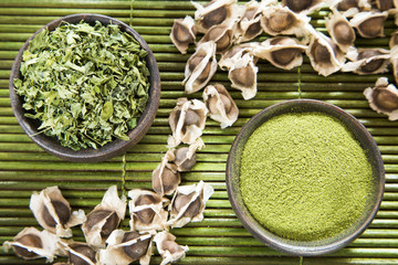 Sticker - Seeds, leaves and moringa powder - Moringa oleifera. Top view