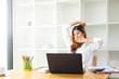 © Prathankarnpap - Tired sleepy asian woman dozy, working at office workplace.