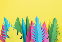 Colorful Tropical Palm Leaves Made Of Paper On Yellow Background. Homemade Craft. Summer Concept