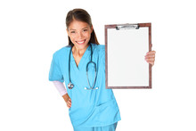 Medical Nurse Or Doctor Asian Woman Showing Blank Clipboard Sign Isolated On White Background Smiling In Blue Scrubs For Advertisement Text On Paper. Multiracial Female Medical Professional.