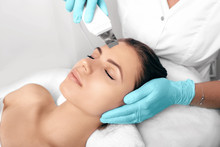 Beautiful Woman Receiving Ultrasound Cavitation Facial Peeling. Cosmetology And Facial Skin Care. Facial Treatment, Face Cleansing