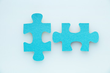 two pieces of a puzzle piece on a white background.