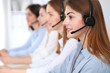 © rogerphoto - Call center. Beautiful cheerful smiling operator consulting clients with headset. Business concept of customer service