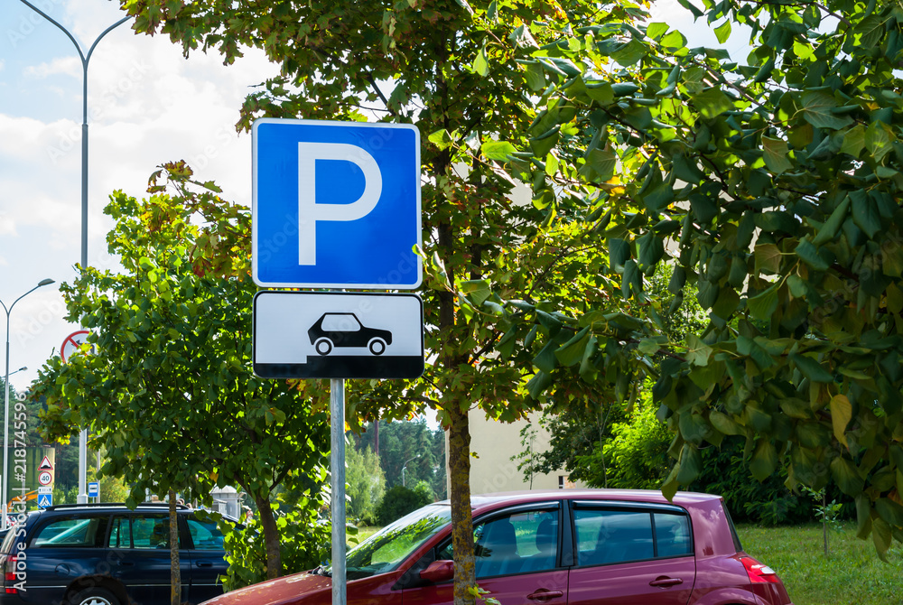 Road traffic sign parking for cars on a city street background showing ...