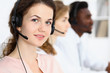 © rogerphoto - Call center operator.Young beautiful  brunette woman in headset. Business concept