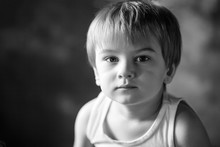 Portrait Of The Little Boy.  Quiet  Boy 3-4 Years Looking At The Camera. Emotional Portrait Close Up. Black-and-white Image