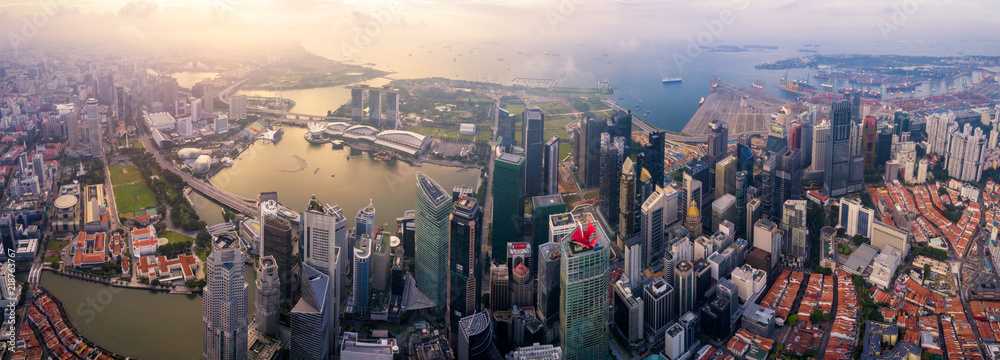 Aerial view of the Singapore landmark financial business district at sunrise scene with skyscraper and over clouds. Panorama of Singapore downtown. - obrazy, fototapety, plakaty 