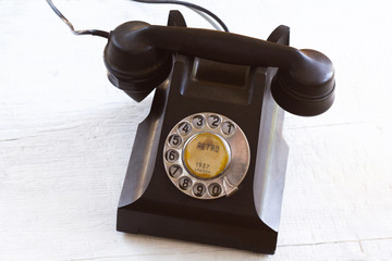 Vintage telephone on a wooden background