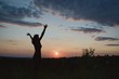 © Tunatura - Young woman  in sunset light. Nature, outdoor, freedom, success, happiness concept