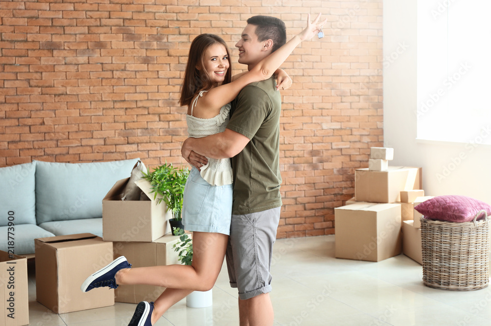 Happy young couple after moving to their new house