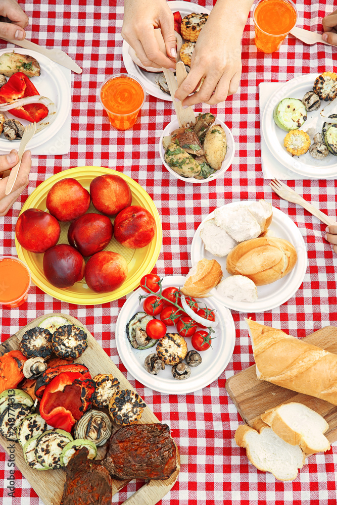 Family having picnic on summer day, top view