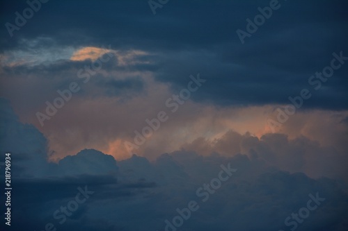 Fotografie, Obraz Turbulent clouds, boiling skies with layers of clouds before the storm