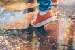 © andrey gonchar - Walking through the spring puddles