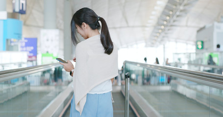 Canvas Print - Woman use of mobile phone in the airport