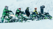 Snowmobile Riders Lined Up Ready To Go