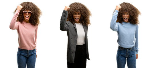 Sticker - African american young woman wearing different outfits angry and mad raising fist frustrated and furious while shouting with anger. Rage and aggressive concept.