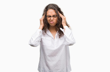 Canvas Print - Beautiful young hispanic woman with hand on head for pain in head because stress. Suffering migraine.