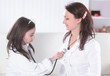 © yurolaitsalbert - little girl listens to her mother with a stethoscope